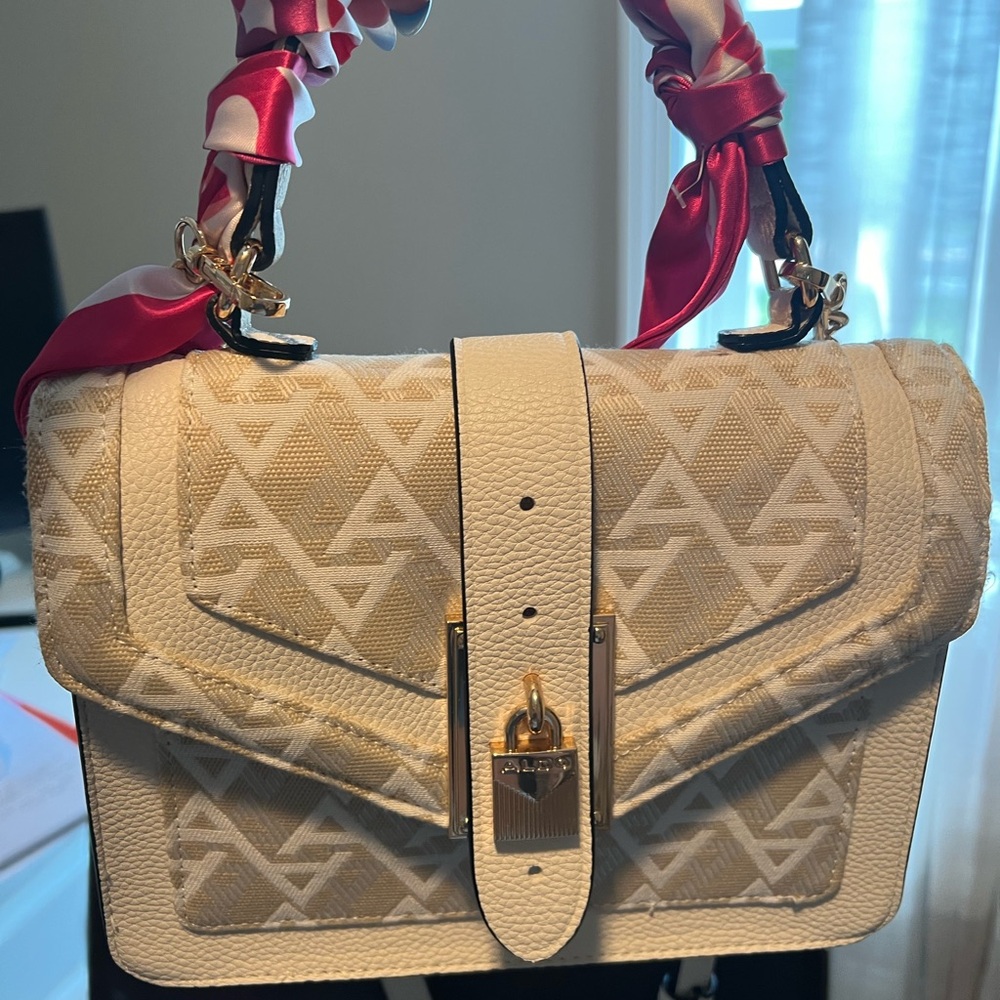 Aldo purse, used once. It’s too small for my purse contents.
